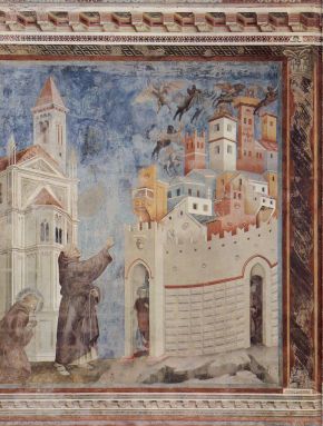 Fresco of a friar raising his arm towards a walled city as winged devils fly away above its towers, while a haloed figure kneels in prayer