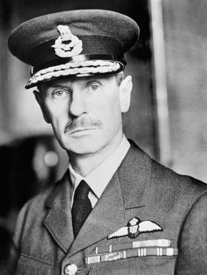 Black-and-white portrait of a man with a moustache in Royal Air Force uniform and peaked cap